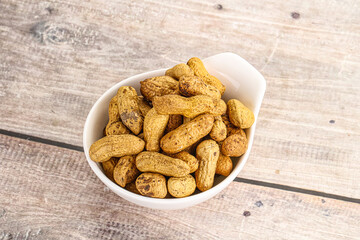 Raw ripe unpeeled peanut heap