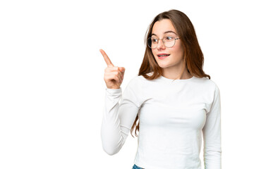 Teenager girl over isolated chroma key background intending to realizes the solution while lifting a finger up