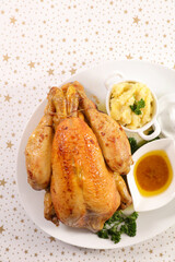 whole roasted chicken with sauce and mashed potato