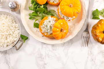 Baked stuffed pumpkin with rice and salad