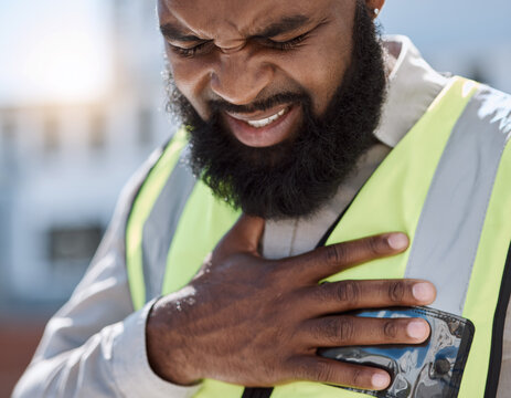 Stress, construction worker and a black man with a heart attack in the city. Healthcare, burnout and an African builder, architect or handyman with anxiety, chest pain or medical emergency on site