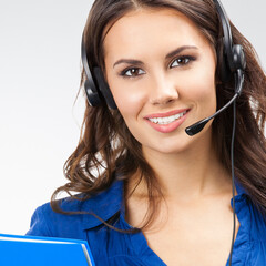 Portrait of happy smiling cheerful beautiful young support phone operator in headset with blue...
