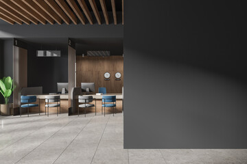 Gray and wooden bank interior with teller counters and blank wall
