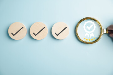Certification and ISO quality concept, magnifying glass highlighting an aligned icon representing...