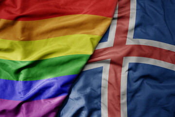 big waving realistic national colorful flag of iceland and rainbow gay pride flag .