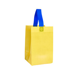 Small yellow canvas shopping bag isolated on white background.
