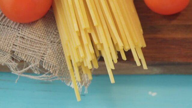 Pasta view of dy authentic Italian spaghetti, cooking with cherry tomatoes