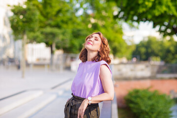 Beautiful successful middle aged woman posing on the street photo shoot