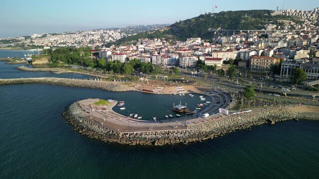 Aerial video of buildings on mountains on the sea shore in Trabzon city, Turkey
