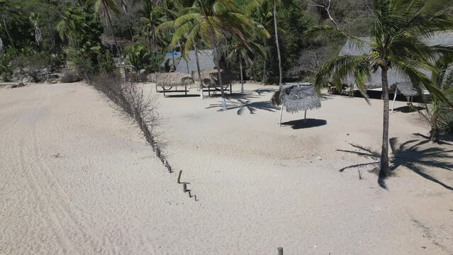 Amazing 4k drone footage of palapas on Yelapa Beach near Puerto Vallarta in Mexico