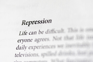 close-up of the psychological term Repression, on paper background