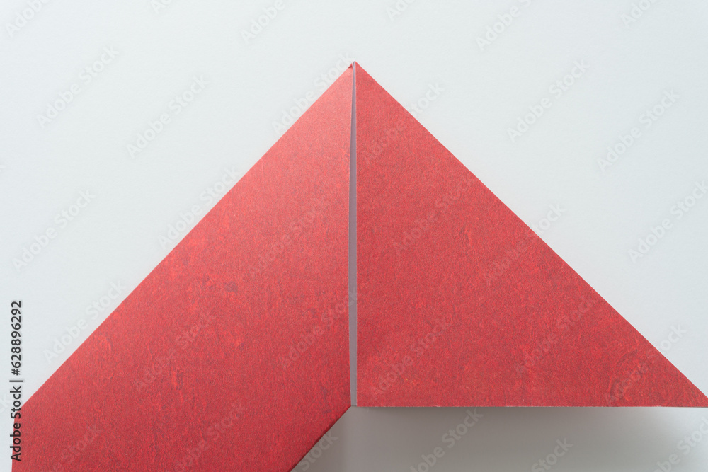 Sticker folded paper in triangular form