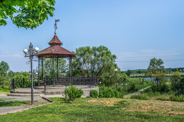 Steel Altanka at the end of the Alley of Lovers on the bank of the pond in the Trostyanets city...