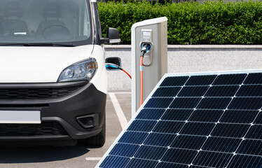 Electric van with charging station and solar panel.