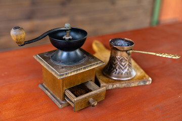 Vintage coffee pot and manual coffee grinder. Retro style of making natural espresso.