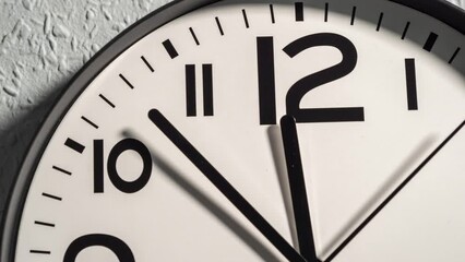 Timelapse of a wall clock. The time is twelve o'clock. Wall clock on a background on a gray wall. - Powered by Adobe