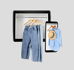 Diffrent clothes on mobile gadgets screens. Online shopping concept.