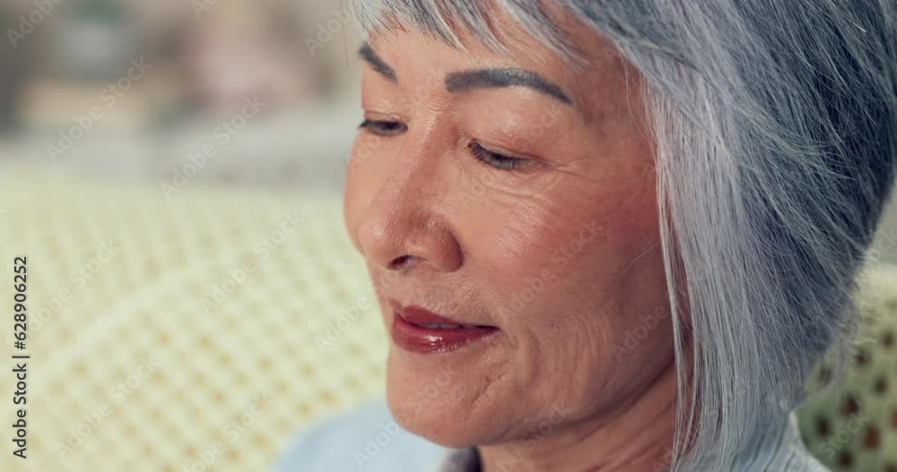 Wall mural Senior woman, Asian face and thinking closeup at retirement home feeling relax and calm on sofa. Living room, elderly female person and happy with peace in a house on a lounge couch with mindfulness