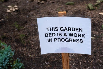 this garden bed is a work in progress signage at the garden park