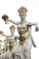 Traditional white stone statues, dancing women, Hindu religion, Hinduism, in Bali island.