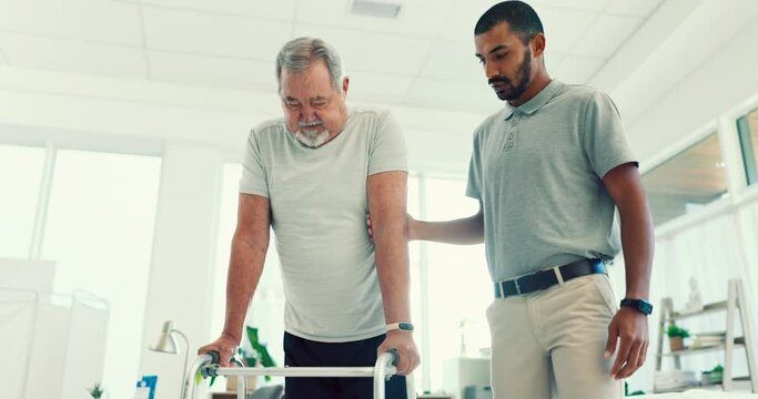 Man, physiotherapist and patient in elderly care with walker for physical therapy or assessment at the clinic. Male medical caregiver helping senior in physiotherapy to walk in healthcare support