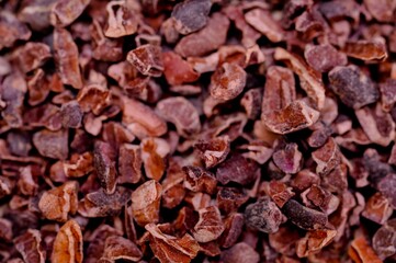 Pile of organic raw cacao nibs