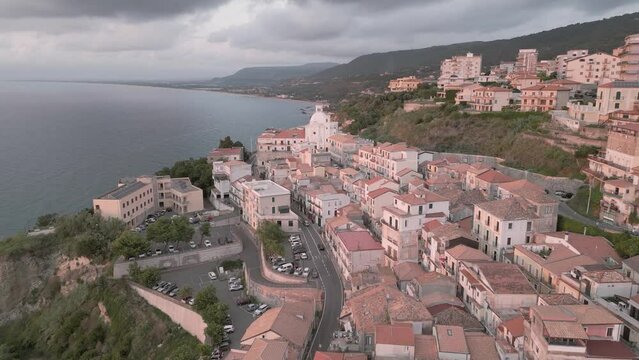 4k 25fps footage: aerial view of the medieval village of Pizzo in Calabria with its Murat castle, the Caribbean sea, the highway behind. The town is overlooking the sea.