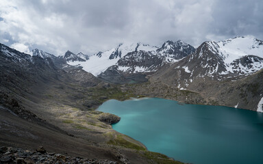 Picturesque turquoise mountain lake Ala-Kul. Tien Shan. Kyrgyzstan.