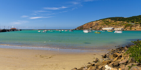 sheltered bay with harbour entrance and several small boats and ships, Oamaru, New Zealand