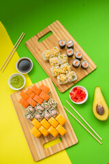 a set of appetizing rolls on a green-yellow background