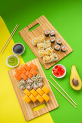 a set of appetizing rolls on a green-yellow background