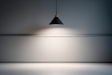 Gray wall with lighting from a metal black lamp.