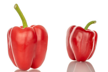 Two red bell peppers, macro, isolated on white background.