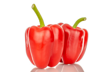 Two red bell peppers, macro, isolated on white background.