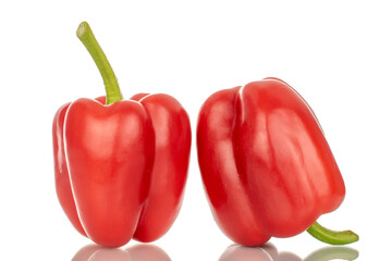 Two red bell peppers, macro, isolated on white background.