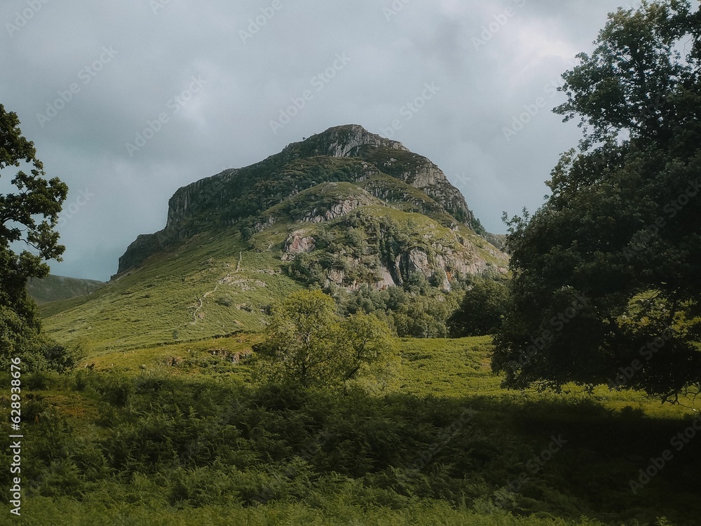 Sticker breathtaking landscape view of a lush mountain range with vibrant green foliage