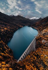 Aerial view of an autumnal scene in South Tyrol, Italy, of the stunning Martell mountain and a lake