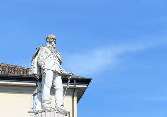 Fototapeta na wymiar Statue of Victor Emanuel II, also called 'Il Vittoriano, padre della patria' with blue sky background in Lodi, Lombardy, Italy