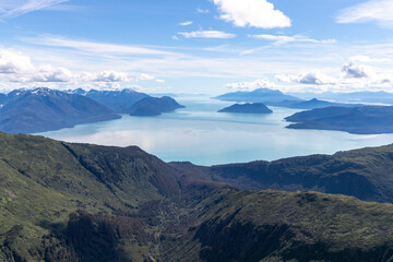 Aerial photo of a mountain peak near Juneau, Alaska with Gastineau Channel and Stephens passage in the background.