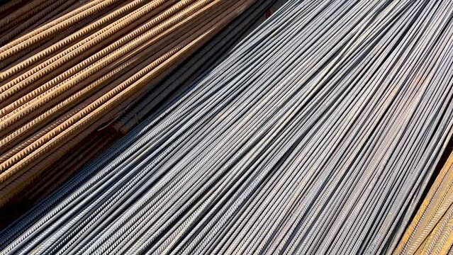 Construction steel rods or bars work reinforcement in conncrete structure of building.Background texture of steel rods used in construction to reinforce concrete