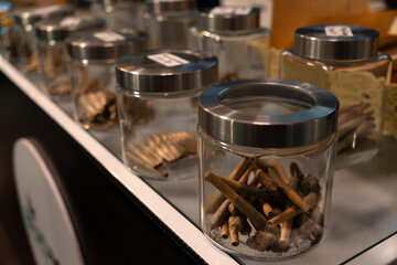 Legalization of light drugs in Thailand. a shop selling marijuana drugs in pattaya, thailand. Glass jars with various types of cannabis on the counter in the store