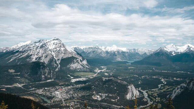 4K time-lapse UHD video of Sulphur Mountain with Mount Rundle and Sulphur Mountain in the background, Alberta, Canada. summer autumn foliage scenery in Banff National Park, Canadian Rockies