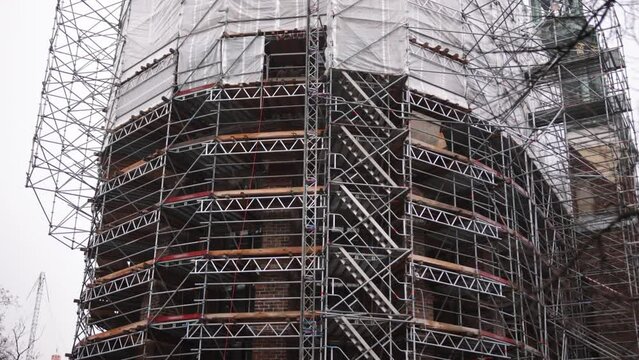 Modern repair, reconstruction house, Energy efficiency. House renovation, External wall insulation, energy savings, Exterior wall heat insulation, building under construction, old building facade