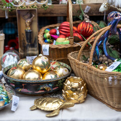 London, UK - 10 December 2022, Liberty Luxury department store various glass balls in silver tones in baskets for sale