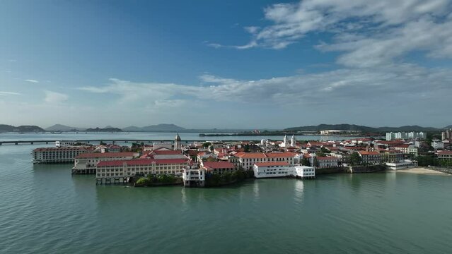 Aerial video of red buildings on the sea shore in San Felipe, Panama City
