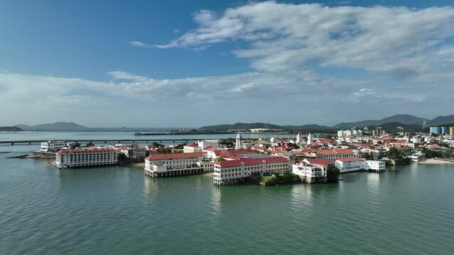 Aerial video of red buildings on the sea shore in San Felipe, Panama City