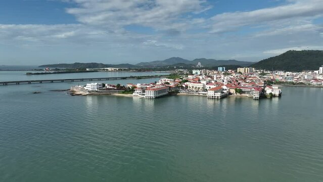 Aerial video of red buildings on the sea shore in San Felipe, Panama City