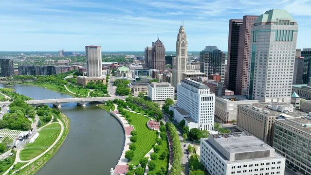 Aerial video downtown Columbus Ohio slow tilt into city from beside river