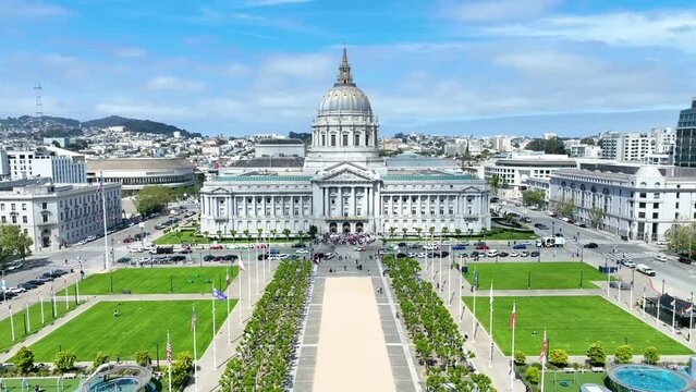 Dolly shot between flags and courtyard leading to San Francisco Superior Courthouse