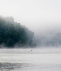 Lone rower in the mist